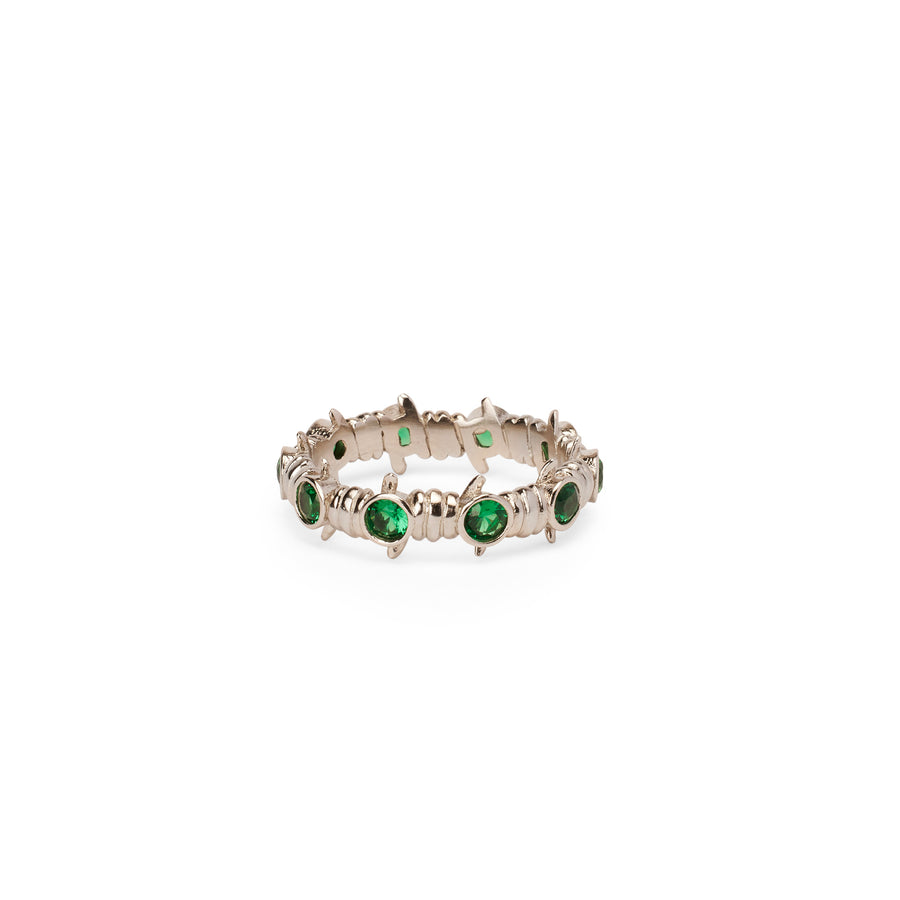 Caught Up Ring in silver with emerald details.