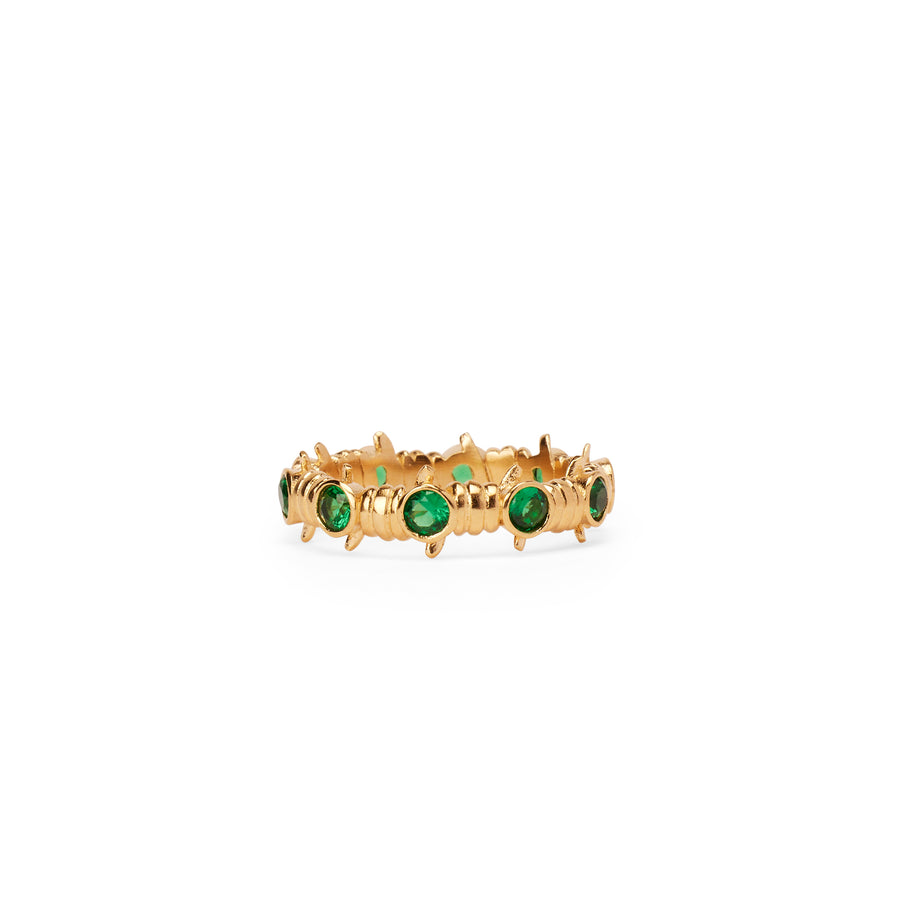 Caught Up Ring in gold with emerald details.