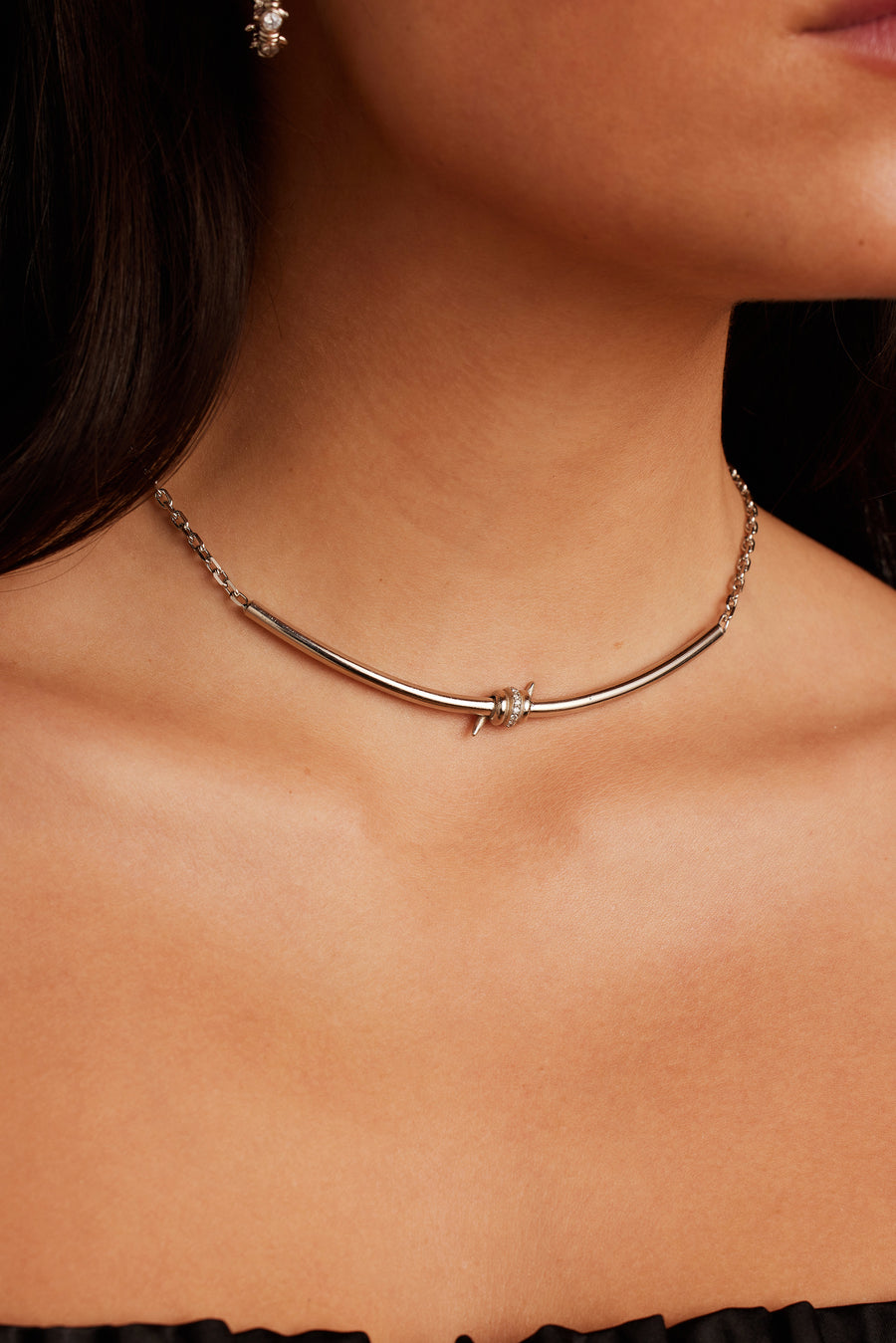 Woman wearing the Last Thorne Necklace in silver.