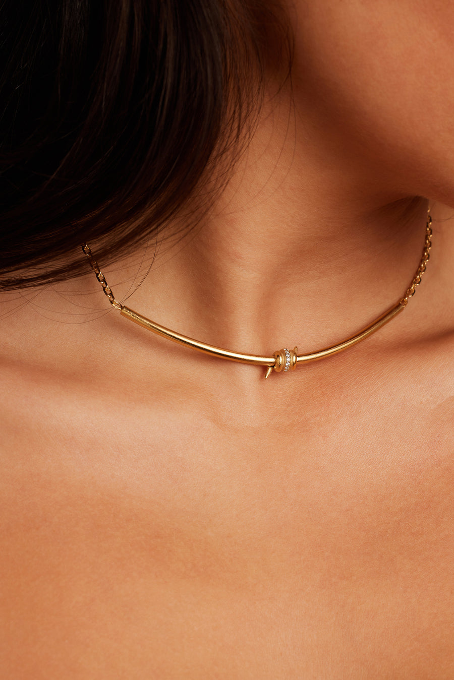 Woman wearing the Last Thorne Necklace in gold.